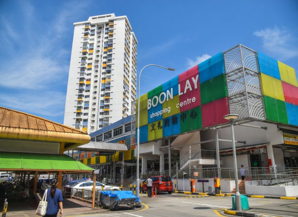boon lay shopping centre exterior with colorful facade and residential block in singapore